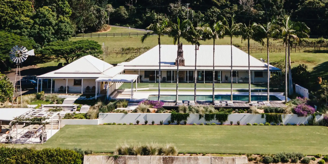 Luxury Queensland villa website displaying clean modern design with horizontal scrolling navigation